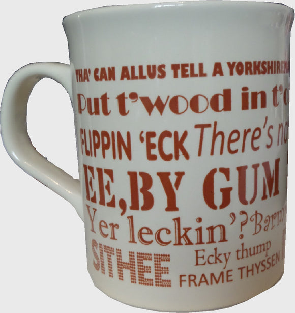Cream earthenware mug, printed in brown with Yorkshire Dialect phrases